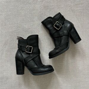 Report chunky black leather boots.